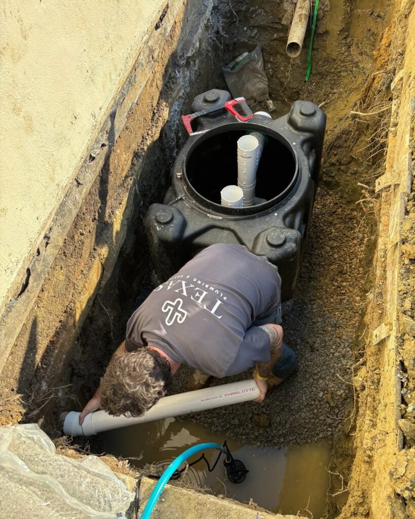 Close-up of plumbing shutoff valve and PVC pipe installation in Aledo, TX