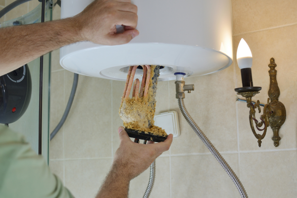 Tankless water heater installation in a residential bathroom in Aledo, TX