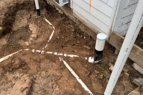 Marked sewer line trench layout before excavation at a home in Aledo, TX